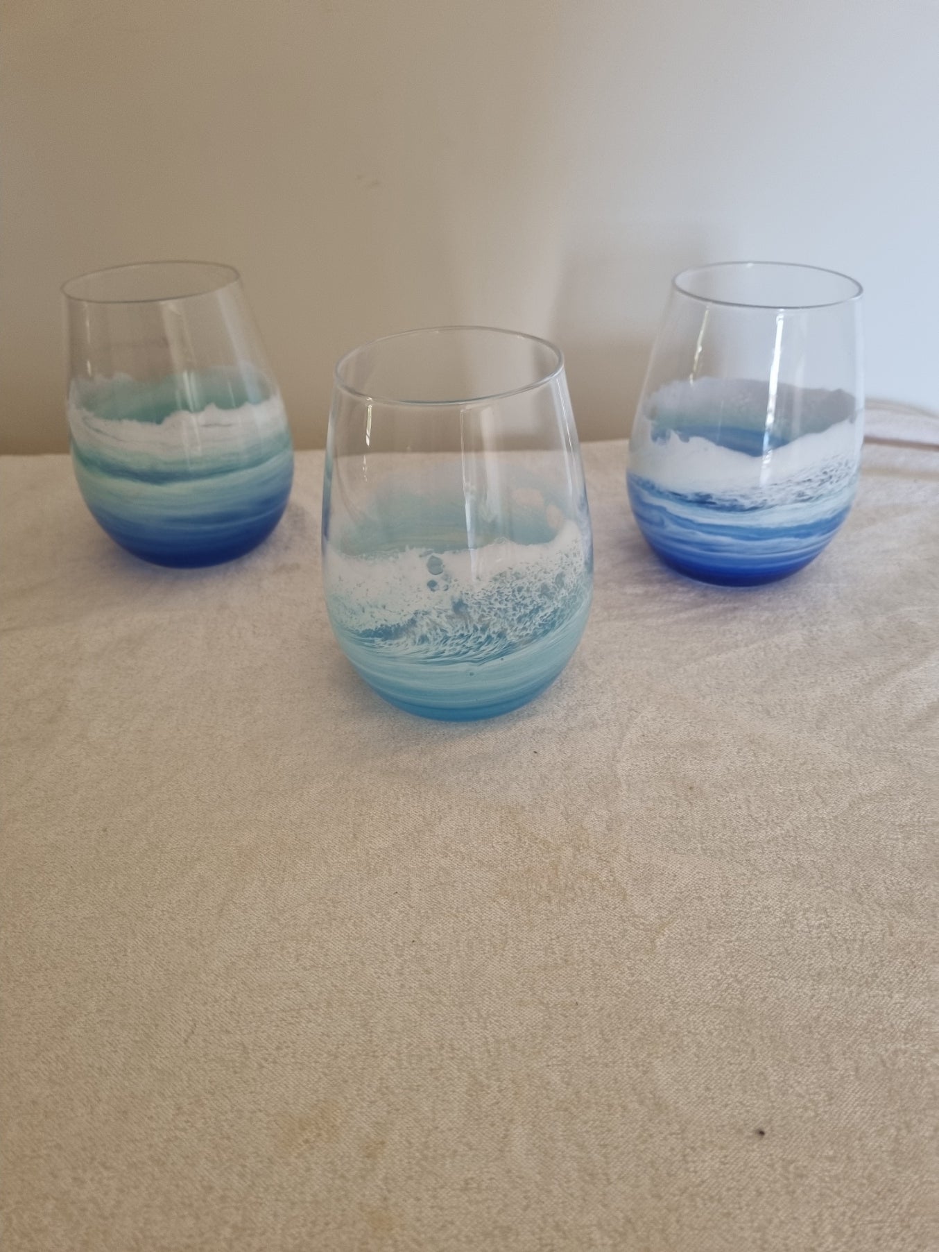 **On Consignment**  Wine glass with resin ocean wave